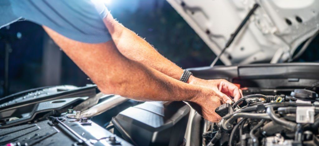 auto mechanic makes inspection and check of honda car engine